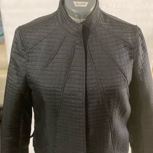 Black embossed poly/ rayon jacket.